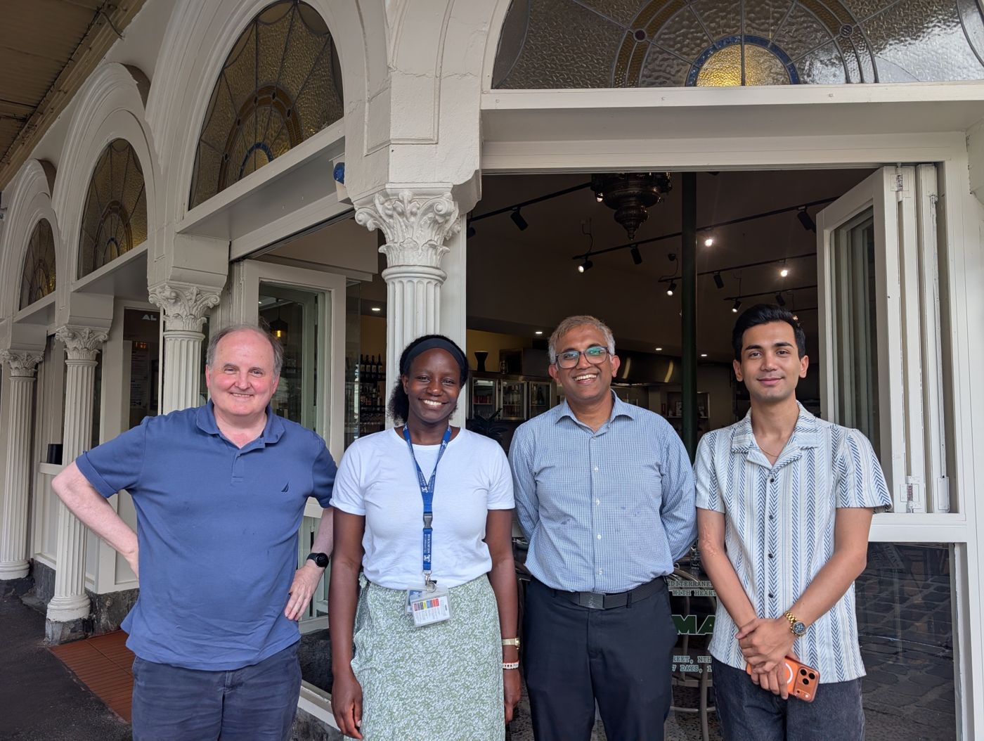 Ramin with members of his supervisory team outside a restaurant